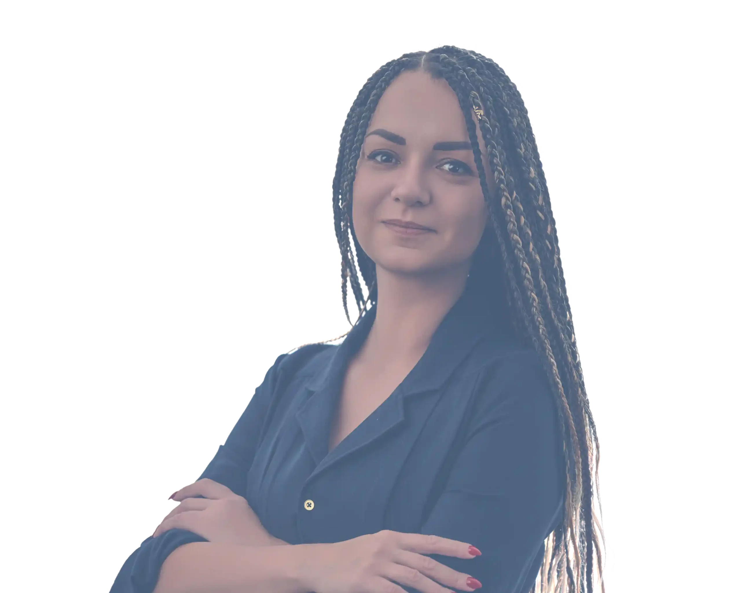 Sylwia Karolina Janiec standing confidently with arms crossed, wearing a navy dress and braided hair, reflecting professionalism and leadership.